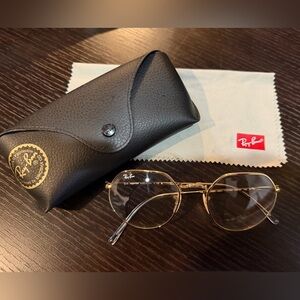 Ray-Ban UNISEX Gold Round Metal Glasses with clear/blue transition lenses